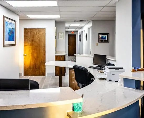 The front desk at John T. Thompson, DDS, looking down the corridor to the treatment rooms.